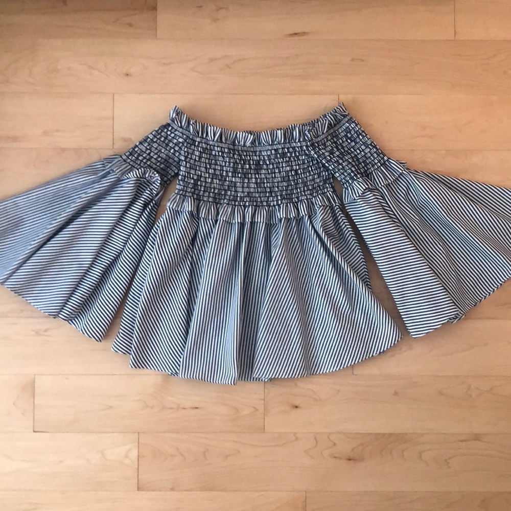Pinstripe off-the-shoulder babydoll blouse.